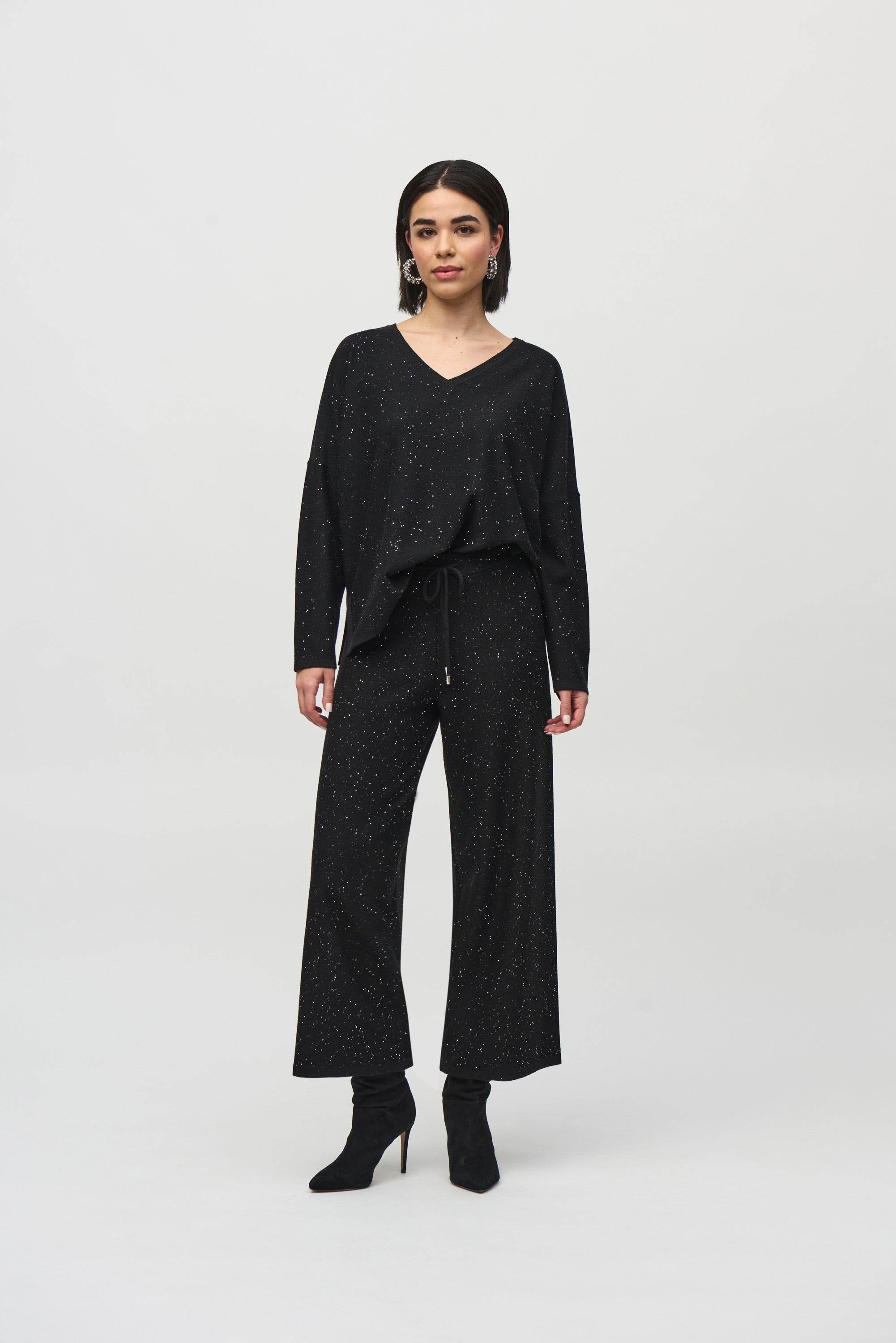 Joseph Ribkoff black Sequined Sweater Knit Boxy Top from the front, back, and side, highlighting the relaxed boxy fit, V-neckline, dolman sleeves, and the fine sequin-embroidered sweater knit texture that adds a subtle allover shimmer.