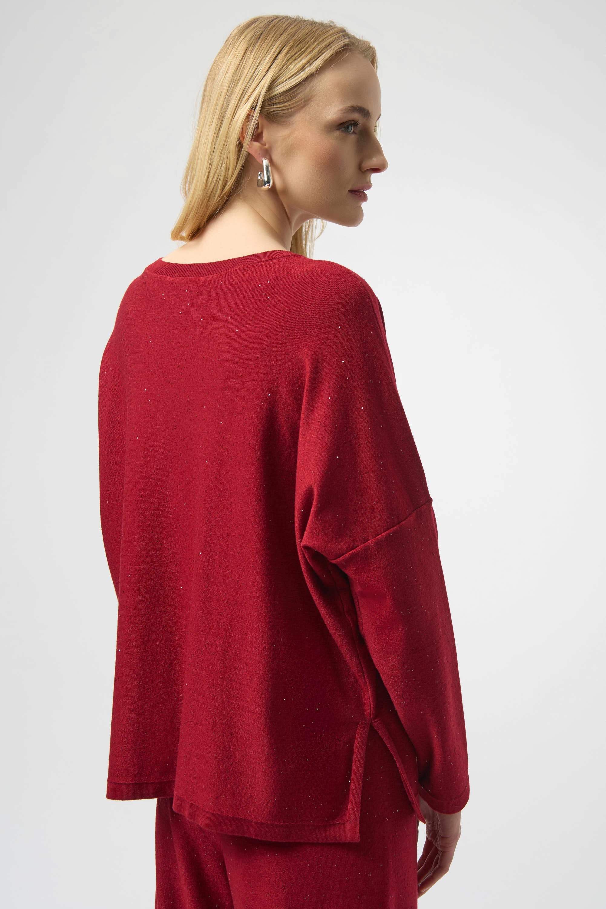 Joseph Ribkoff cherry Sequined Sweater Knit Boxy Top from the front, back, and side, highlighting the relaxed boxy fit, V-neckline, dolman sleeves, and the fine sequin-embroidered sweater knit texture that adds a subtle allover shimmer.