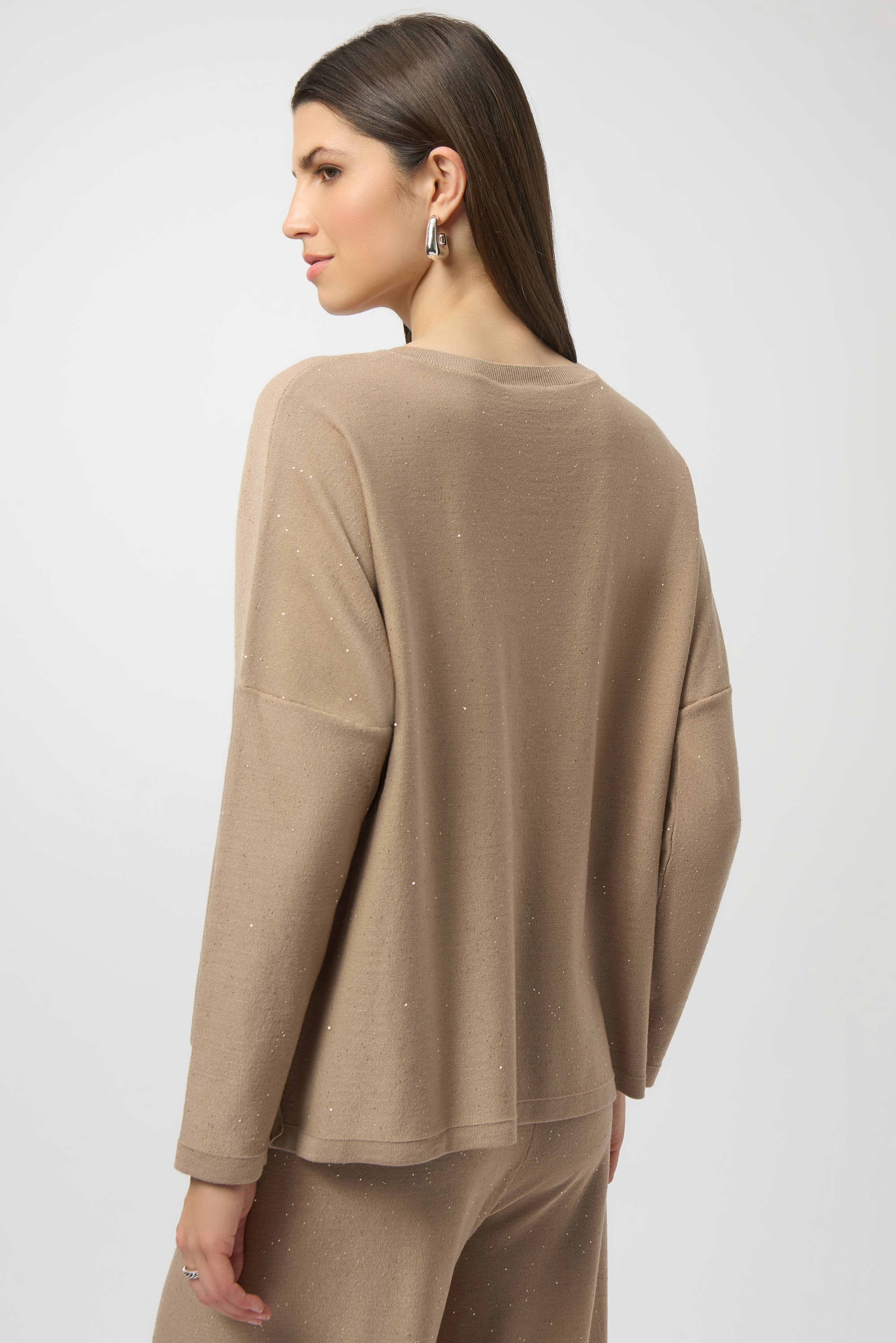 Joseph Ribkoff Sequined Sweater Knit Boxy Top in Fawn, from the front, back, and side, highlighting the relaxed boxy fit, V-neckline, dolman sleeves, and the fine sequin-embroidered sweater knit texture that adds a subtle allover shimmer.