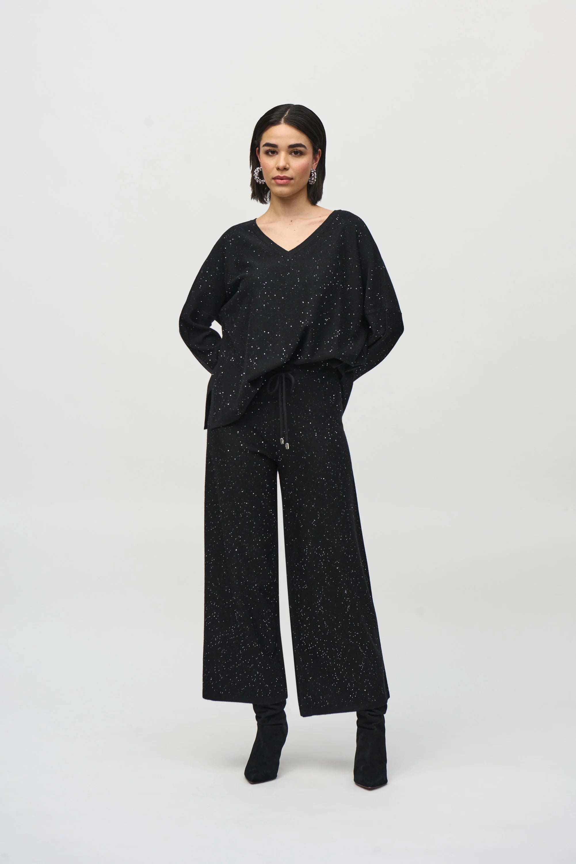 Sequined Sweater Knit Culotte Pants by Joseph Ribkoff, highlighting the viscose blend texture, shimmering sequins, culotte silhouette, and elastic waistband.
