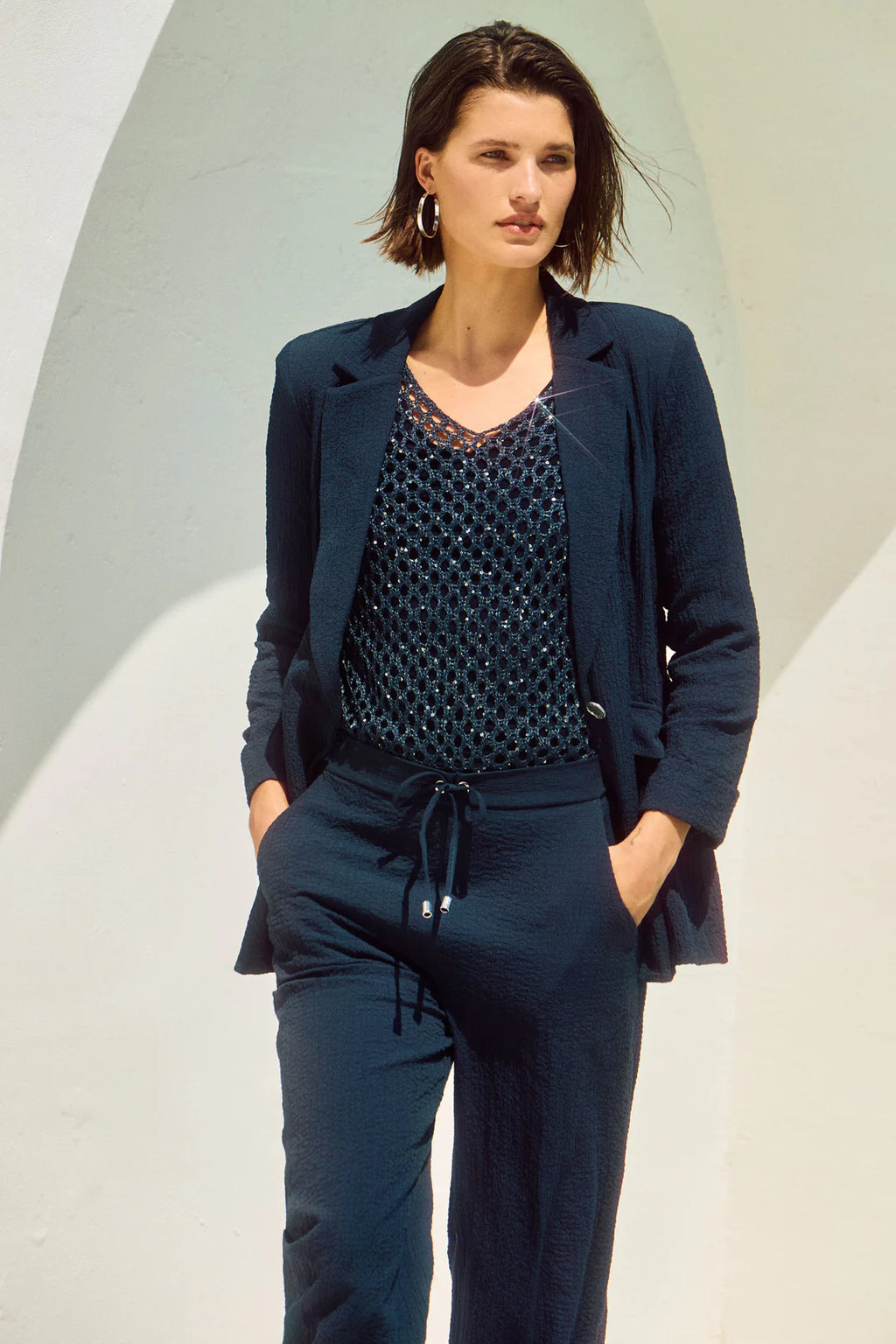 Joseph Ribkoff Open Stitch Sweater with Sequins from multiple angles. Highlights include the open stitch texture, sequin detailing, relaxed fit, and V-neckline.