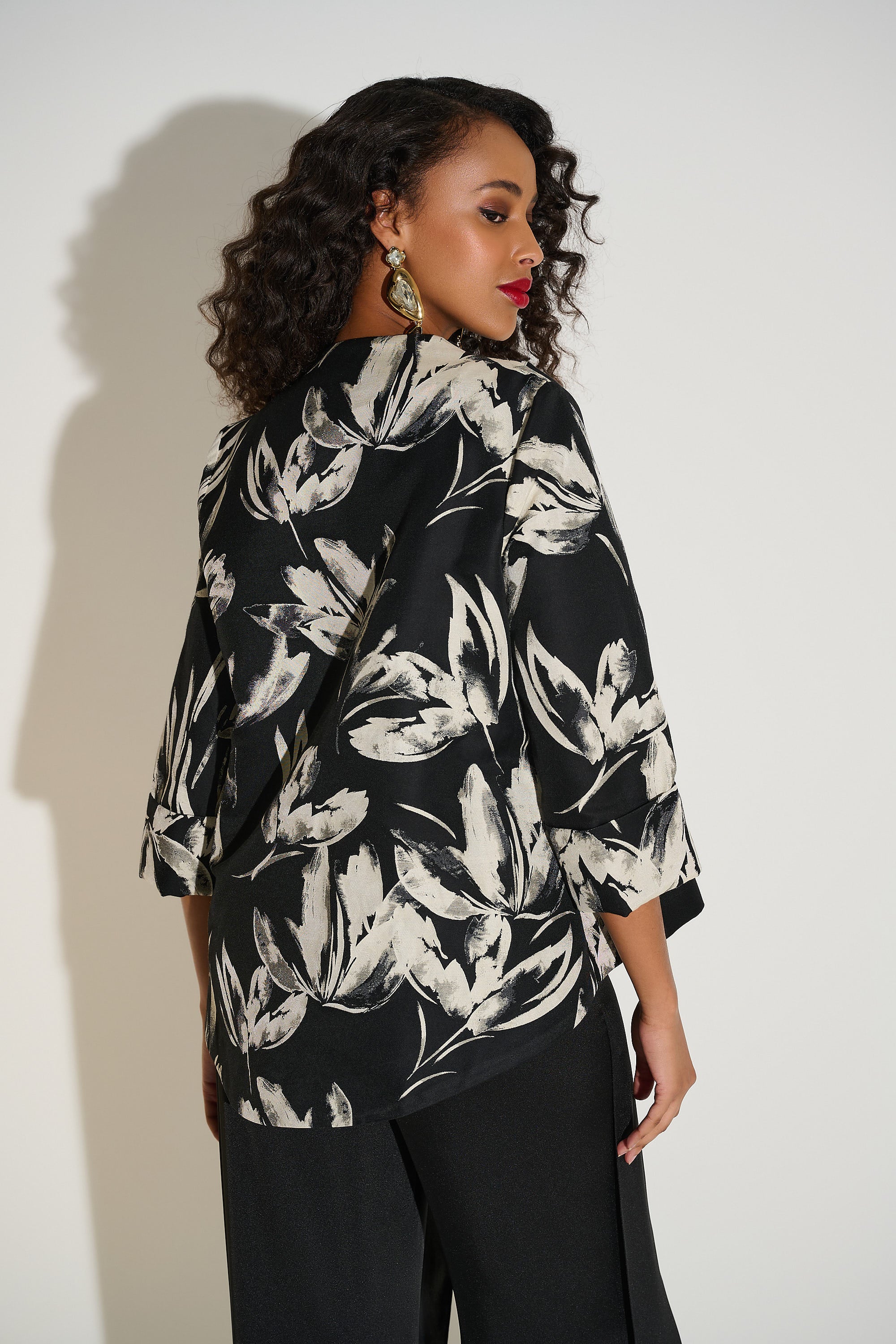 Jacquard Floral Print Swing Jacket by Joseph Ribkoff, highlighting the floral jacquard pattern, funnel collar, three-quarter cuffed sleeves, and swing silhouette.