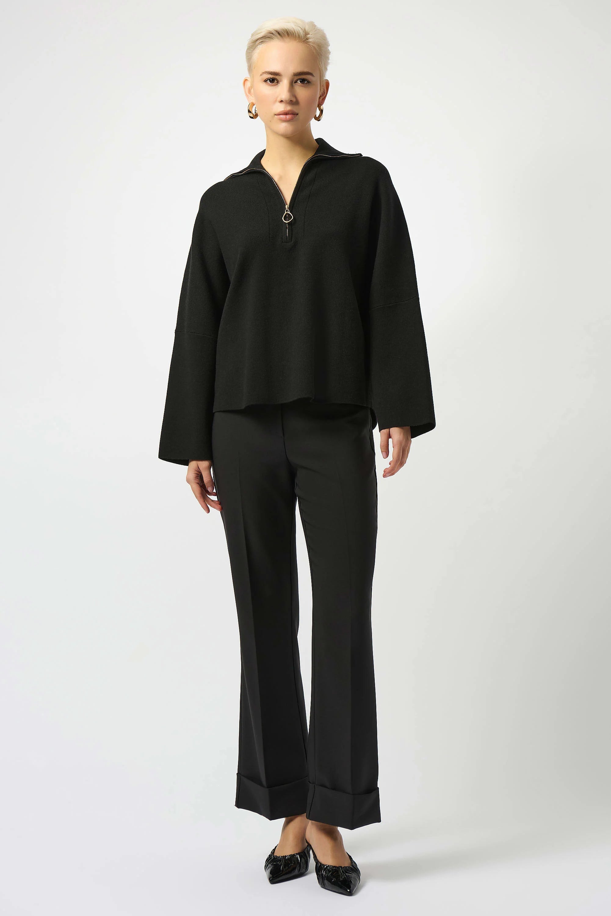 Showcasing the Sweater Knit Boxy Pullover with Zipped Collar by Joseph Ribkoff. Highlights include the relaxed boxy silhouette, functional zip collar, bell sleeves. Available colors Black, Winter White, Avocado, and Medallion, emphasizing fabric texture and fit.
