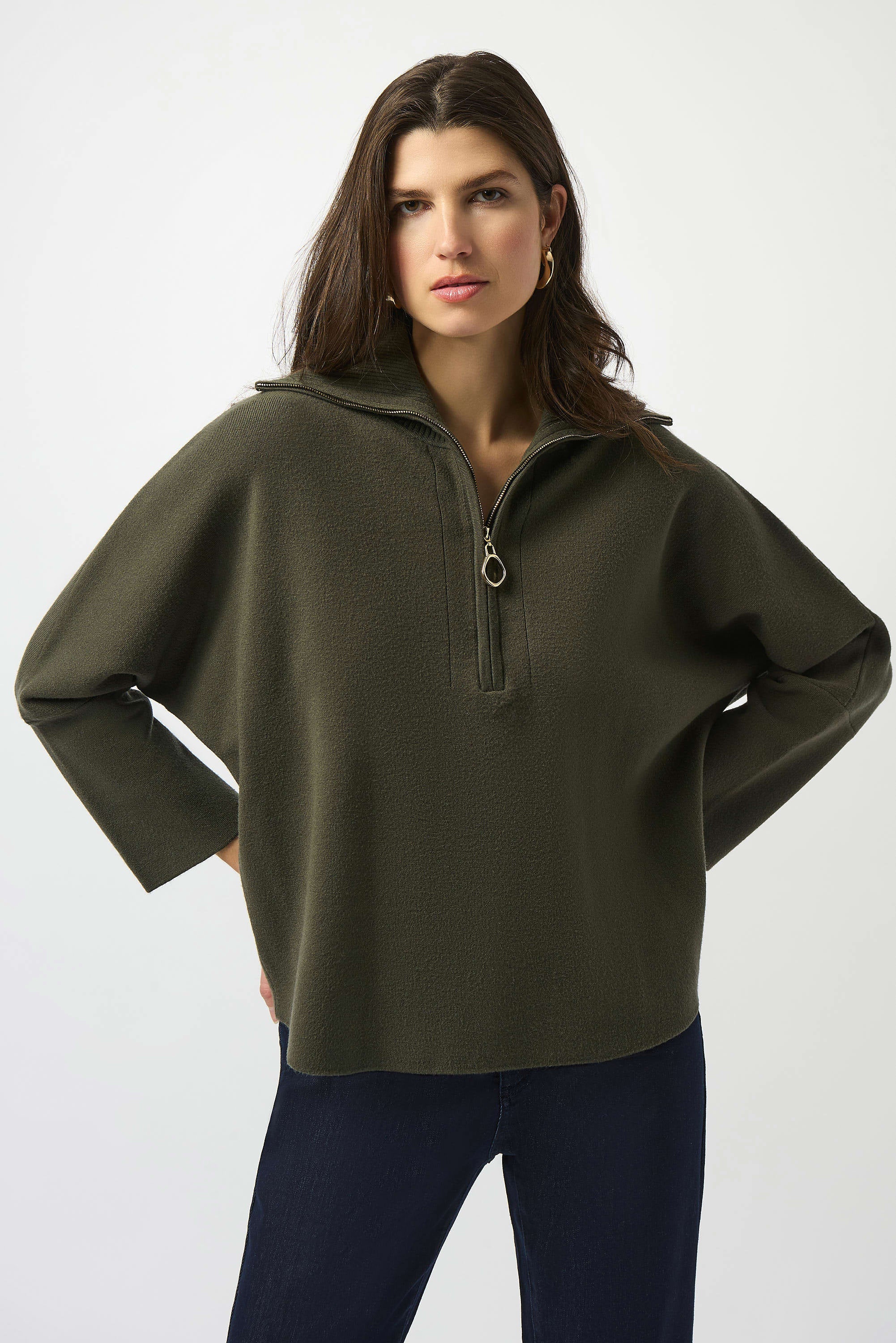 Showcasing the Sweater Knit Boxy Pullover with Zipped Collar by Joseph Ribkoff. Highlights include the relaxed boxy silhouette, functional zip collar, bell sleeves. Available colors Black, Winter White, Avocado, and Medallion, emphasizing fabric texture and fit.