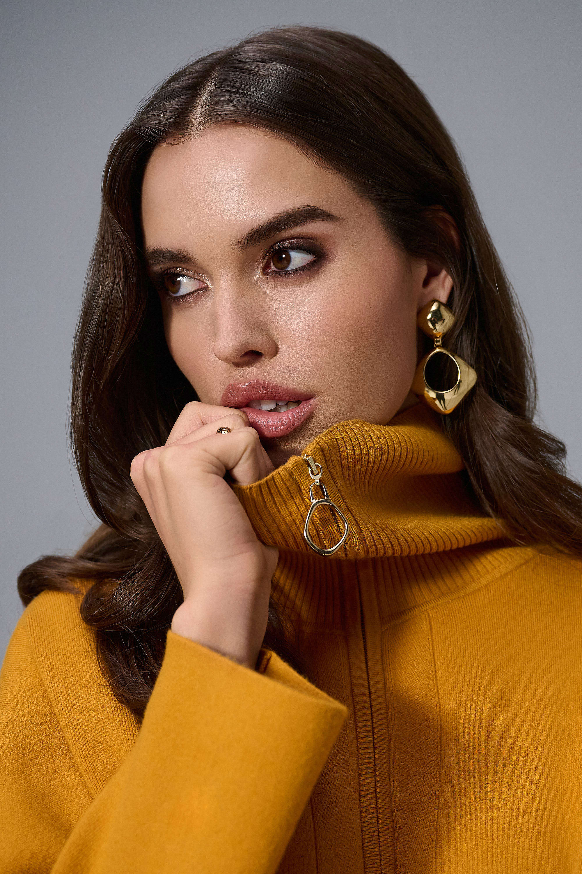 Showcasing the Sweater Knit Boxy Pullover with Zipped Collar by Joseph Ribkoff. Highlights include the relaxed boxy silhouette, functional zip collar, bell sleeves. Available colors Black, Winter White, Avocado, and Medallion, emphasizing fabric texture and fit.