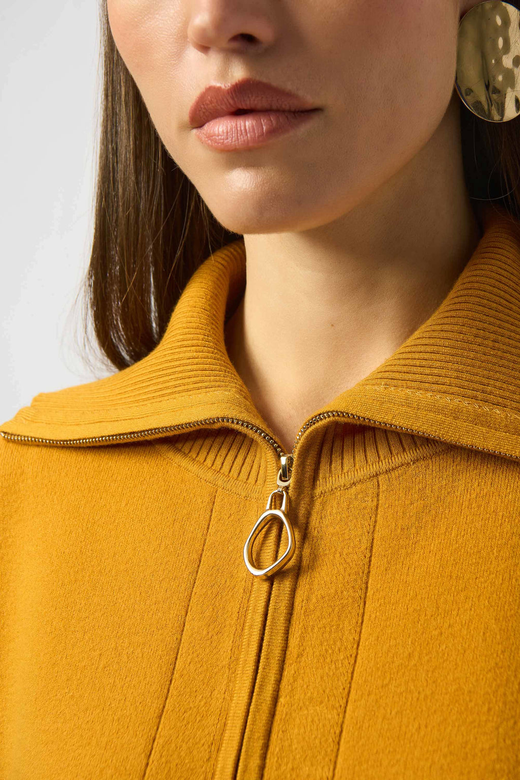 Showcasing the Sweater Knit Boxy Pullover with Zipped Collar by Joseph Ribkoff. Highlights include the relaxed boxy silhouette, functional zip collar, bell sleeves. Available colors Black, Winter White, Avocado, and Medallion, emphasizing fabric texture and fit.