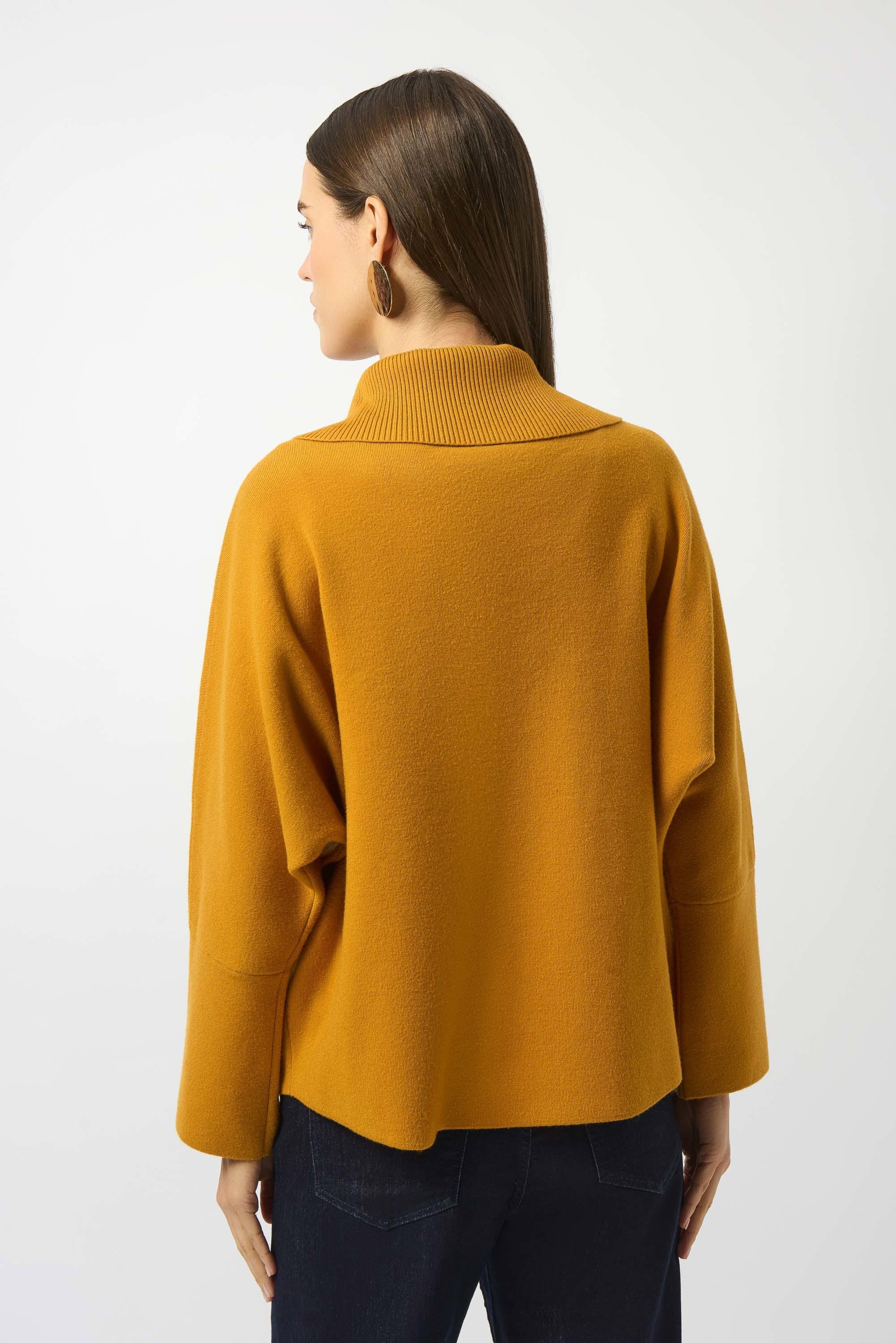 Showcasing the Sweater Knit Boxy Pullover with Zipped Collar by Joseph Ribkoff. Highlights include the relaxed boxy silhouette, functional zip collar, bell sleeves. Available colors Black, Winter White, Avocado, and Medallion, emphasizing fabric texture and fit.