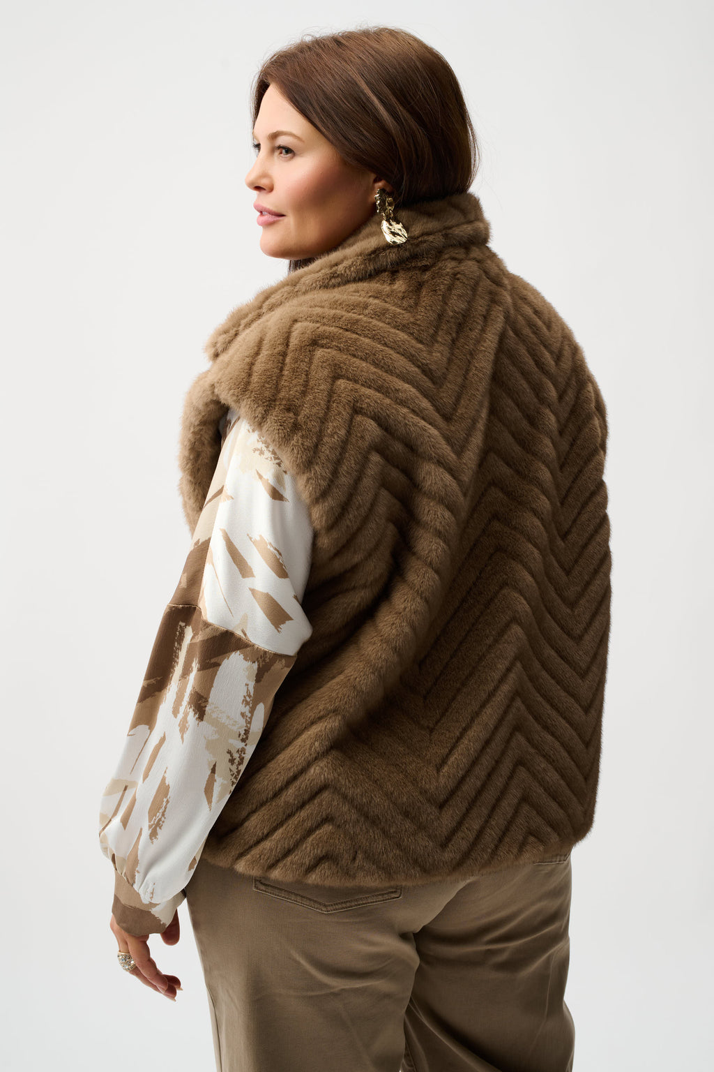 Sweater Knit Boxy Pullover with Zipped Collar by Joseph Ribkoff, showcasing its relaxed boxy fit, functional zip-up collar, and long sleeves. The images highlight the soft knit fabric texture and the pullover’s availability in four stylish colors: Black, Winter White, Avocado, and Medallion. Photos capture front, back, and close-up details to illustrate design and quality.