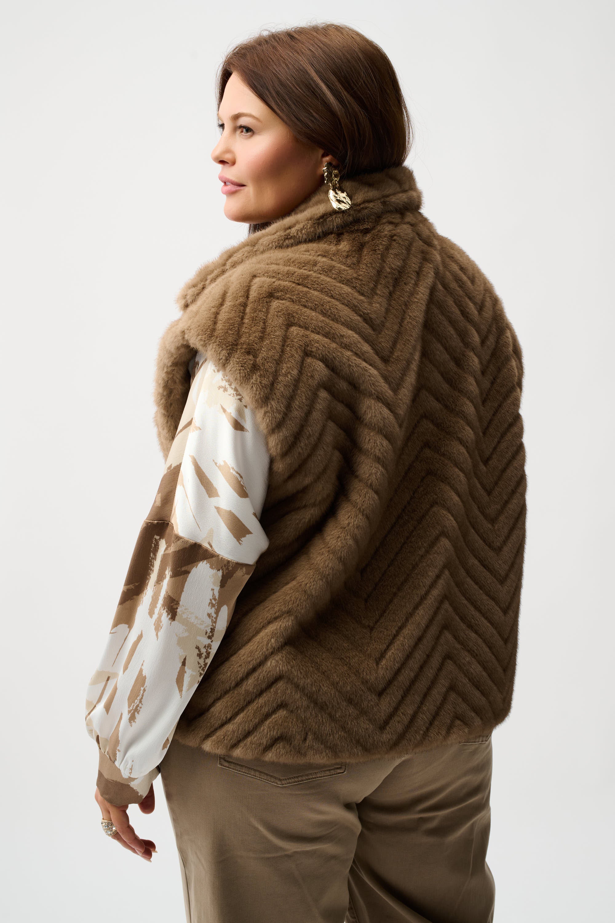 Sweater Knit Boxy Pullover with Zipped Collar by Joseph Ribkoff, showcasing its relaxed boxy fit, functional zip-up collar, and long sleeves. The images highlight the soft knit fabric texture and the pullover’s availability in four stylish colors: Black, Winter White, Avocado, and Medallion. Photos capture front, back, and close-up details to illustrate design and quality.