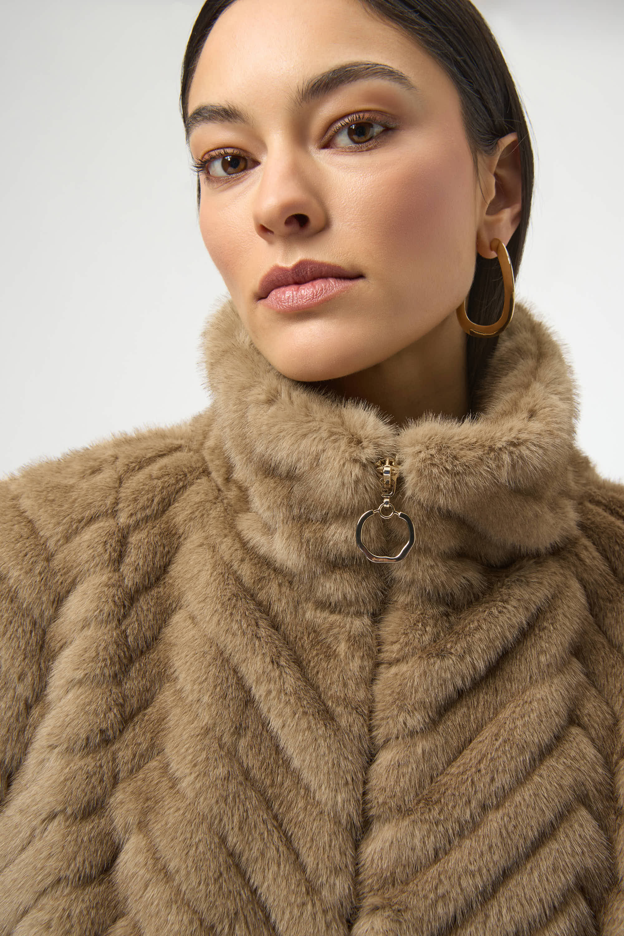 Sweater Knit Boxy Pullover with Zipped Collar by Joseph Ribkoff, showcasing its relaxed boxy fit, functional zip-up collar, and long sleeves. The images highlight the soft knit fabric texture and the pullover’s availability in four stylish colors: Black, Winter White, Avocado, and Medallion. Photos capture front, back, and close-up details to illustrate design and quality.