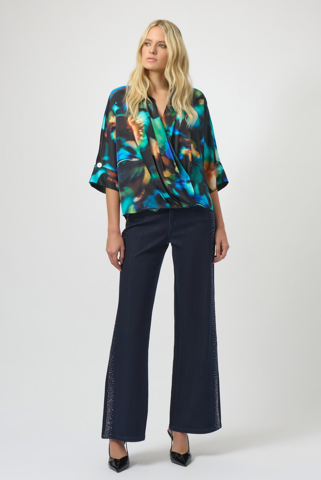 Classic Wide Leg Jeans by Joseph Ribkoff in dark denim blue, highlighting the wide-leg fit, rhinestone detailing along the seams, and classic denim texture. Photos include front, back, and close-up views focusing on sparkling rhinestone accents and fabric quality.