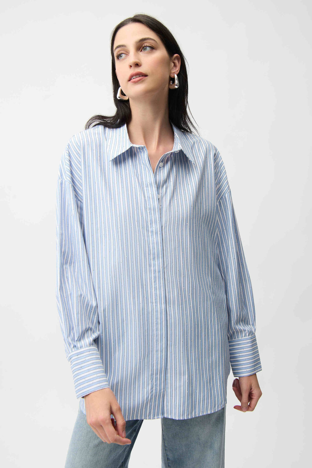 Clear product images showcasing the Tencel Stripe Print Boxy Blouse by Joseph Ribkoff. Highlighting the relaxed boxy fit, vertical stripe pattern, classic collar, and buttoned long sleeves. Visual details emphasize the soft fabric texture and stylish versatility suitable for various occasions.