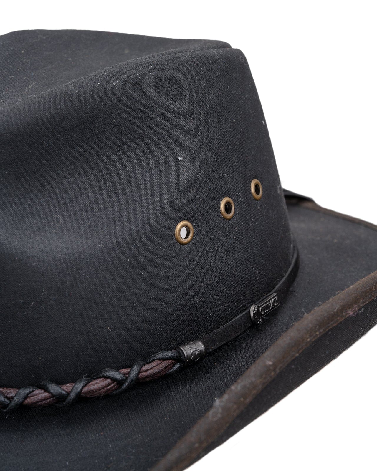 Bootlegger Oilskin Hat in black by Outback Trading Co., showcasing its structured crown, wire brim, chin cord, and moisture-wicking sweatband. Photos include front, side, and rear views highlighting the hat’s rugged material, shape, and functional details.