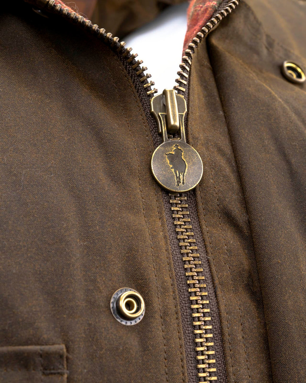 Men's Overlander Vest by Outlander Trading Co. showcasing its rugged water-resistant fabric, front zip and snap closure, multiple pockets, and adjustable side tabs. Views include front, back, and close-up shots highlighting functional details and sturdy craftsmanship.