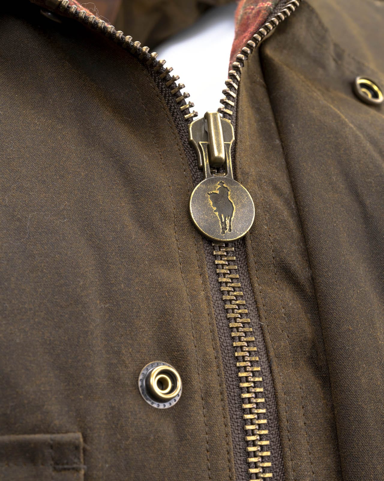 Men's Overlander Vest by Outlander Trading Co. showcasing its rugged water-resistant fabric, front zip and snap closure, multiple pockets, and adjustable side tabs. Views include front, back, and close-up shots highlighting functional details and sturdy craftsmanship.