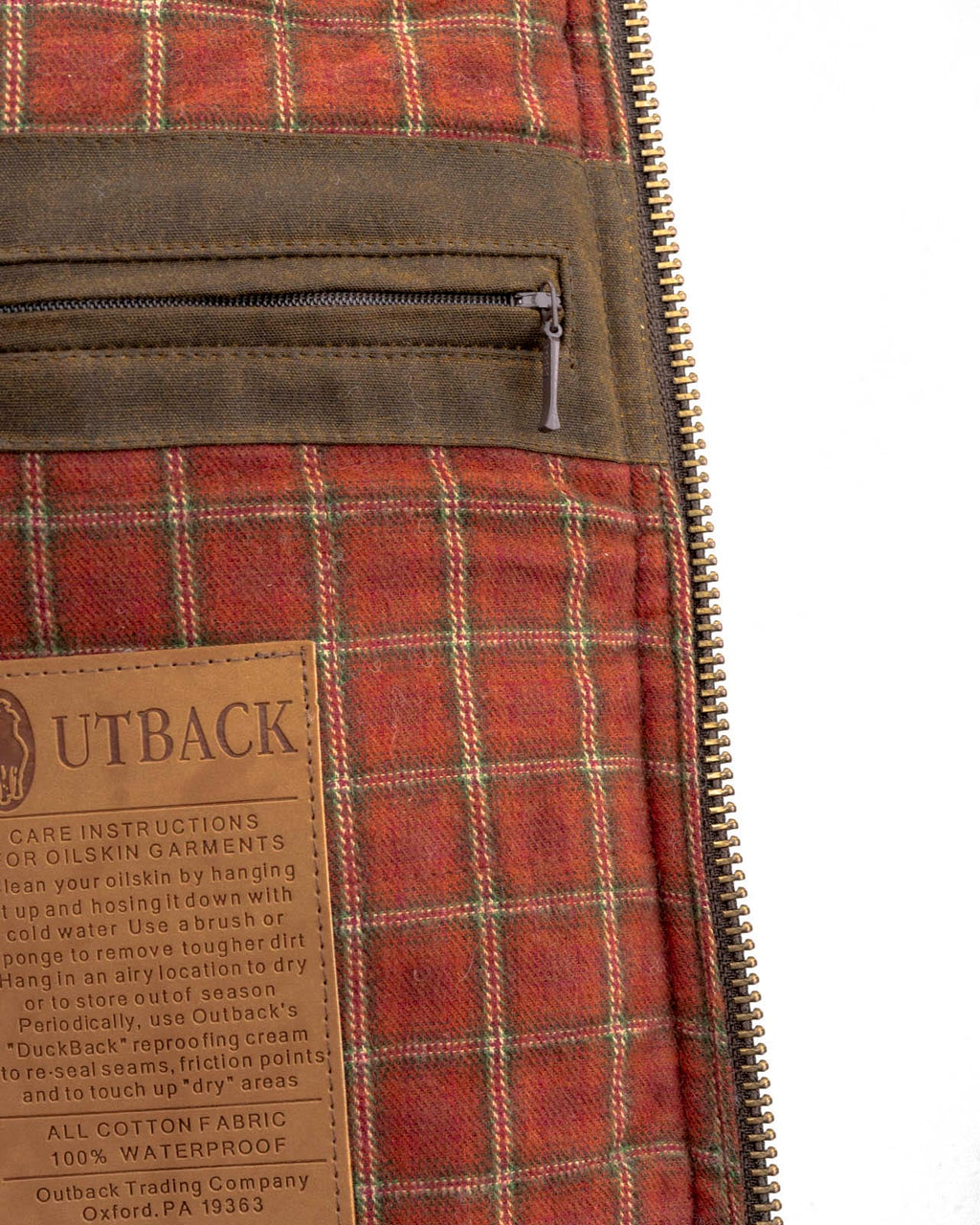 Men's Overlander Vest by Outlander Trading Co. showcasing its rugged water-resistant fabric, front zip and snap closure, multiple pockets, and adjustable side tabs. Views include front, back, and close-up shots highlighting functional details and sturdy craftsmanship.