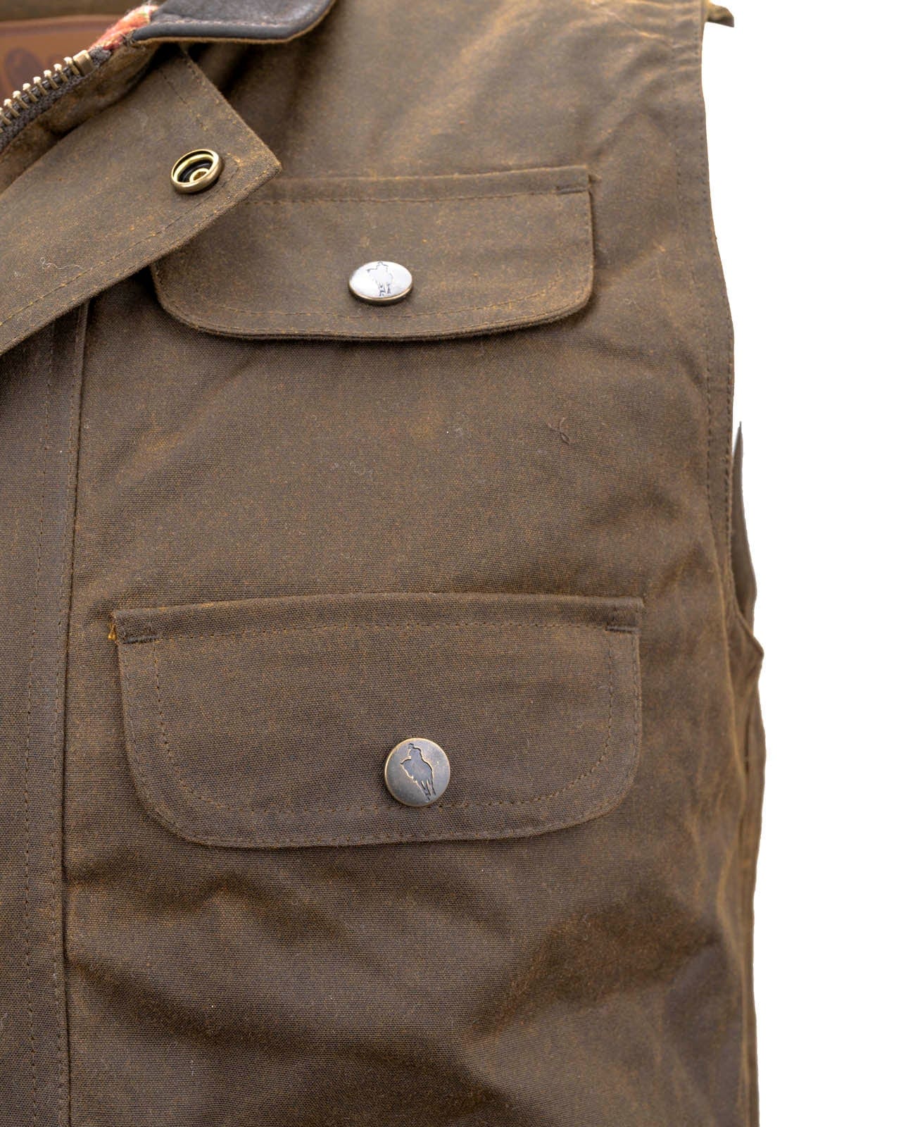 Men's Overlander Vest by Outlander Trading Co. showcasing its rugged water-resistant fabric, front zip and snap closure, multiple pockets, and adjustable side tabs. Views include front, back, and close-up shots highlighting functional details and sturdy craftsmanship.