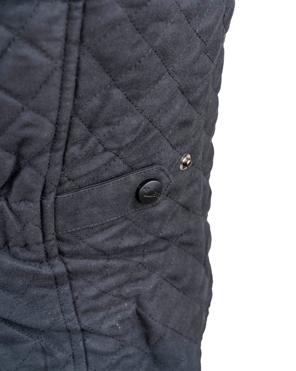 Women’s Grand Prix Vest by Outback Trading Co. in black, highlighting the quilted microsuede fabric, 2-way zipper closure, zippered pockets, adjustable back tabs, and drop-tail hem. Photos provide front, back, and close-up views emphasizing texture, fit, and craftsmanship.
