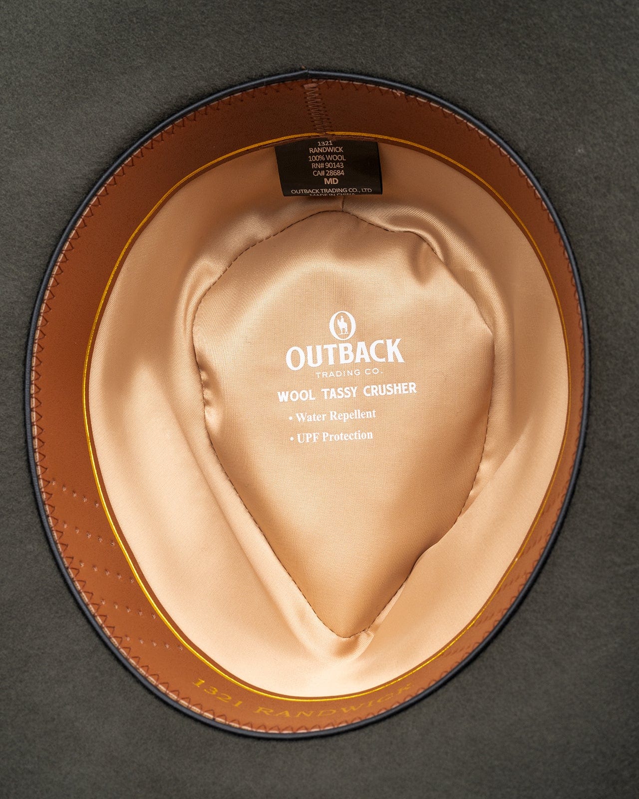 The Randwick Wool Hat by Outback Trading Co. in moss, highlighting its soft wool texture, classic western crown, sturdy brim, distinctive accent feather, and comfortable sateen lining. Photos provide front, side, and back views demonstrating fit and design details.